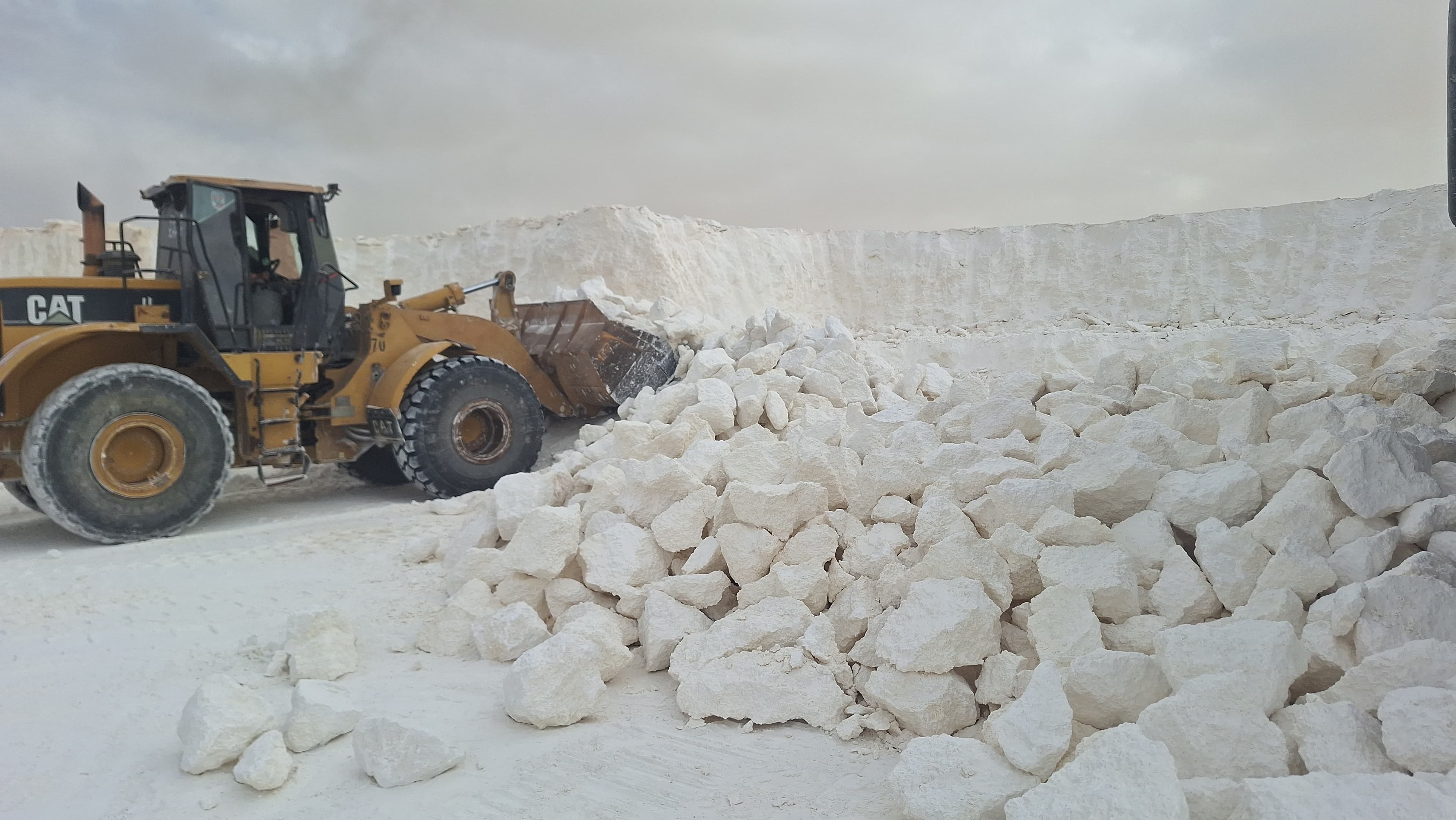 Excavator operating inside an Astro quarry